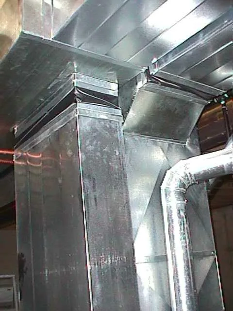 Custom fabricated sheet metal ductwork with a round takeoff