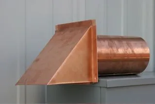 Copper dryer vent with a peaked hood, side view